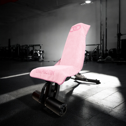 MULTI-FUNCTIONAL HOODED GYM TOWEL on a workout bench, showcasing its premium design and pink color for full coverage.